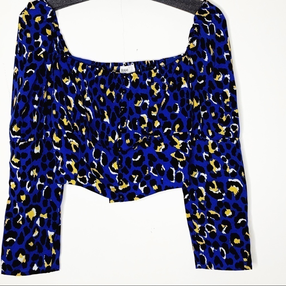 RAHI crop top. Blue with black and yellow print.
